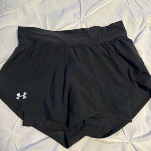 Black small under armor shorts with zipper in back.